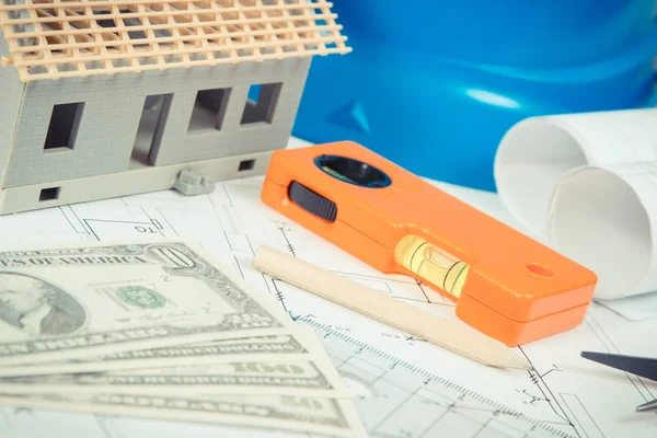 Dollar, electrical diagrams, work tools and accessories and house under construction