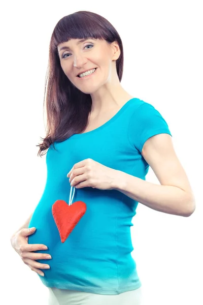 Vintage foto, lacht zwangere vrouw bedrijf hart en hand op haar buik, verwacht voor pasgeboren concept — Stockfoto