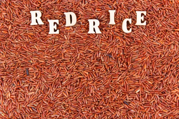 Heap of red rice, healthy, gluten free nutrition concept, copy space for text
