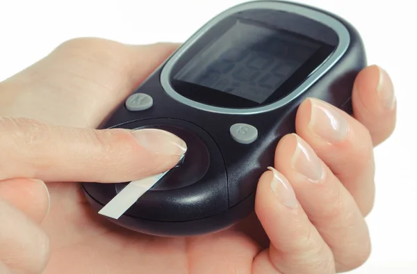 Glucose meter with finger. Checking sugar level concept — Stock Photo, Image