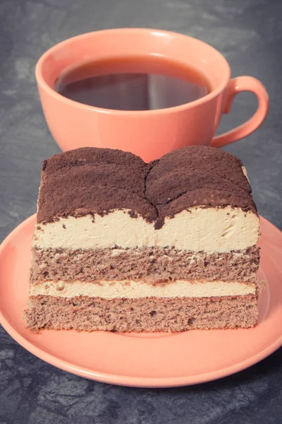 Creamy tiramisu cake with different layers and black coffee. Delicious dessert for celebrations — Stock Photo, Image