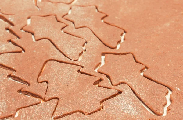 Dough for Christmas cookies in shape of christmas tree and star — Stock Photo, Image