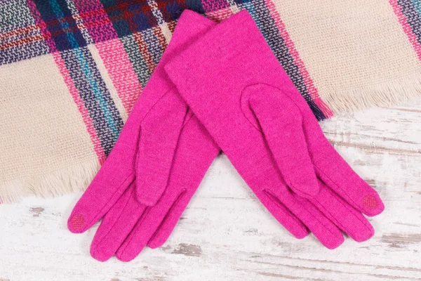 Womanly pink gloves and colorful shawl for autumn or winter — Stock Photo, Image