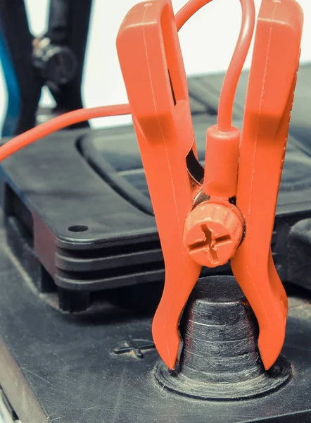 Car battery with clamps and connected cables of charger — 스톡 사진