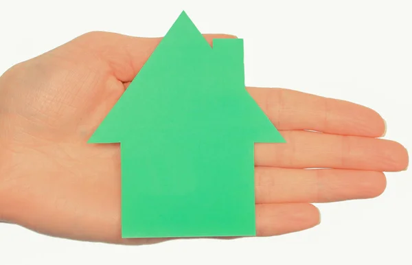 Hand of woman with shape of green house. Ecology house — Stock Photo, Image