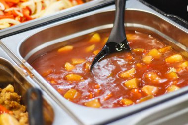 Fresh prepared eating with tomato sauce and vegetables