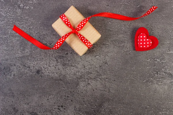 Wrapped gift and red heart for Valentines Day. Copy space for text — Stok fotoğraf