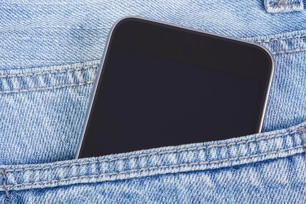 Mobile phone with blank screen in pocket jeans, smartphone