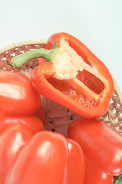 Vintage photo, Heap of red peppers in wicker basket on white background, concept of healthy nutrition — Stock Photo, Image