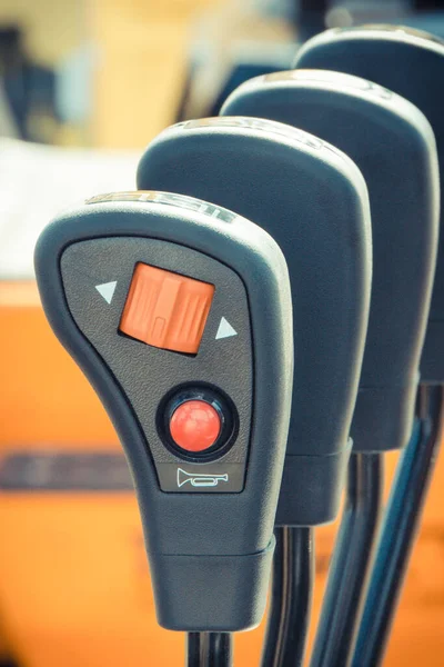 Operating control panels or levers with buttons in forklift or other industrial machine — Stock Photo, Image