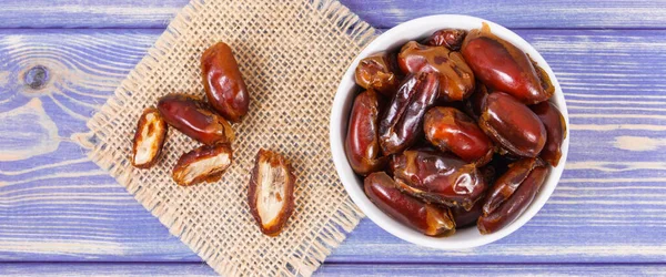 Dates containing vitamins and dietary fiber, natural sources of minerals, concept of healthy lifestyle and nutrition