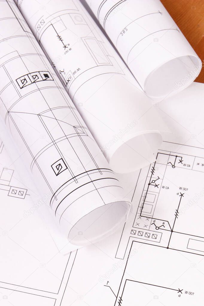Rolls of diagrams or electrical construction drawings for engineer jobs, technology concept