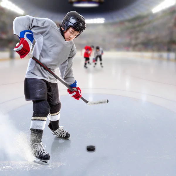 Junior Hockey Player Puck Handling in Arena