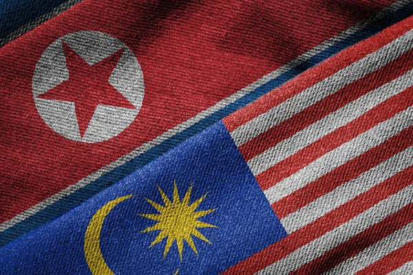 Flags of Malaysia and North Korea on Grunge Texture — Stock Photo, Image