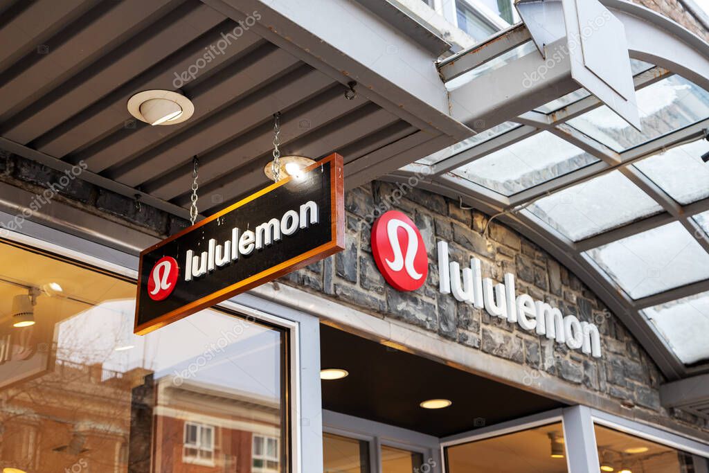 BANFF, CANADA - FEB 15, 2020 : Lululemon store with its sign on busy Banff Avenue in Alberta, Canada. The athletic apparel retailer is made famous for its yoga wear.