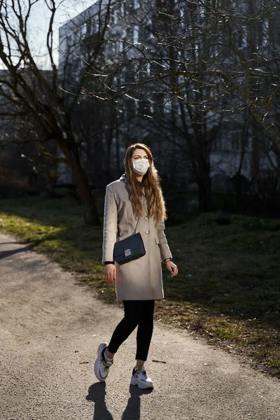 Girl Long Hair Protective Medical Mask Stands Sunlight Background Trees — Stock Photo, Image