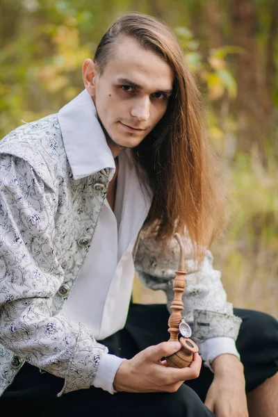 Sexy Long Haired Man Pipe His Hands Woods Beautiful Ancient — Stock Photo, Image