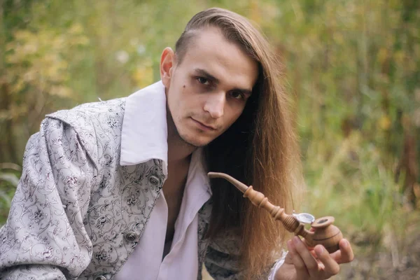 Sexy Long Haired Man Pipe His Hands Woods Beautiful Ancient — Stock Photo, Image