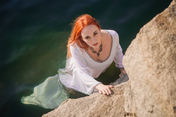 Beautiful Red Haired Girl Floating Water Rocky Coast Model Emerald — Stock Photo, Image