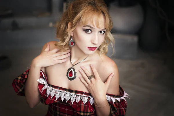 girl in red, checkered dress. An ancient image. Model with white hair