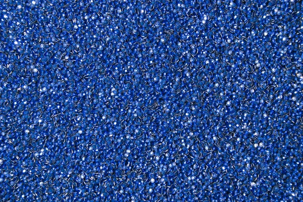Adhesive rhinestones. A lot of blue glue rhinestones. Background