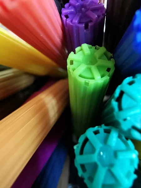 multi-colored caps of felt-tip pens view between felt-tip pens