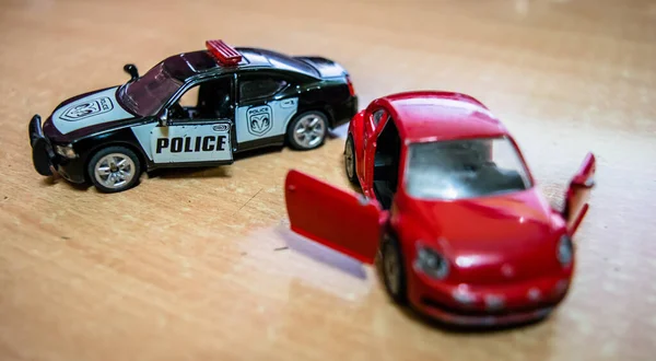 Mattel toy car and truck, toy model car on a wooden table in soft focus