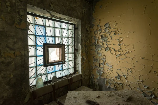 Window in abandoned room of river station in Chernobyl zone, ghost city of Pripyat, Ukraine