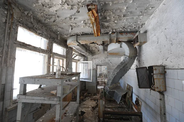 Kitchen in abandoned school in ghost town Pripyat, post apocalyptic interior, Chernobyl zone, Ukraine