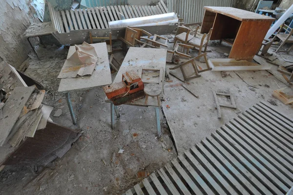 Interior of abandoned kindergarten in Chernobyl zone, broken furniture,  post apocalyptic interior in ghost town Pripyat, Ukraine