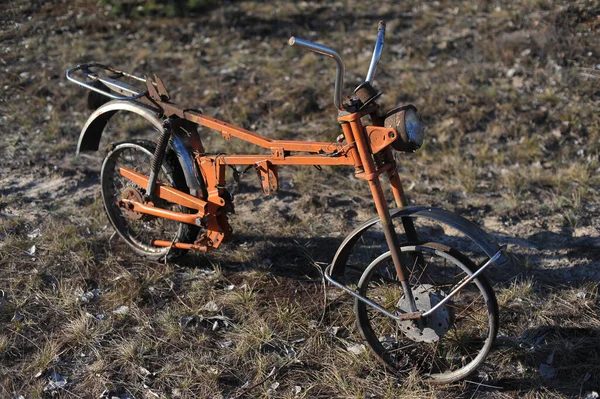 Abandoned radioactive vehicle, old rusty motorcycyle near ghost town Pripyat, post apocalyptic city, spring season in Chernobyl exclusion zone, Ukraine