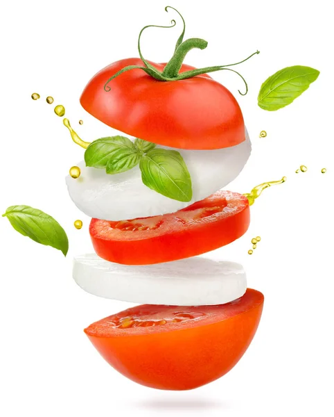 Rodajas Tomate Queso Mozzarella Albahaca Volando Sobre Fondo Blanco —  Fotos de Stock