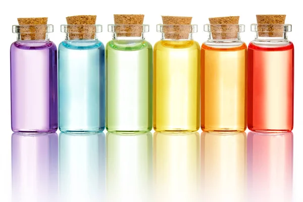 Бутылки Цветными Эфирными Маслами Изолированы Белом — стоковое фото