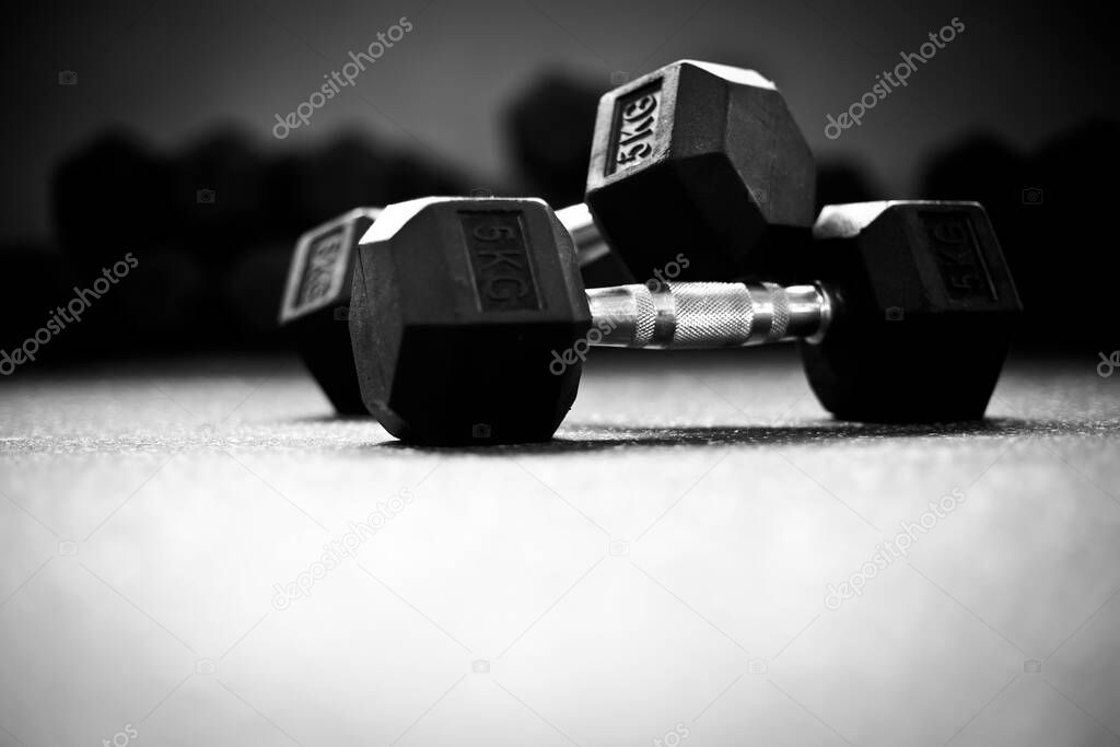 Dumbbells on the floor in a CrossFit gym