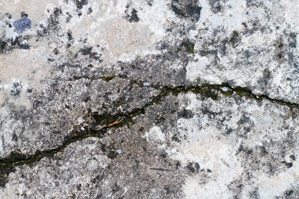 Fragmento rachadura no piso de concreto fundo — Fotografia de Stock