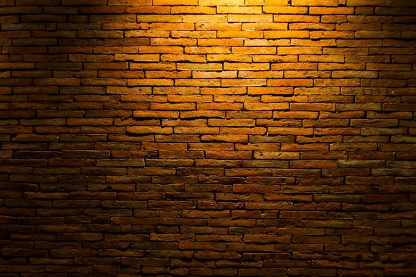 Muro di mattoni con luce per sfondo astratto — Foto Stock