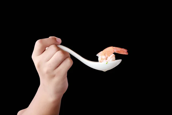 Shrimp in a spoon isolated on black background.This had clipping path.