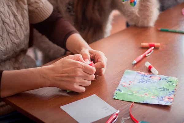 Woman making doll — Stock Photo, Image