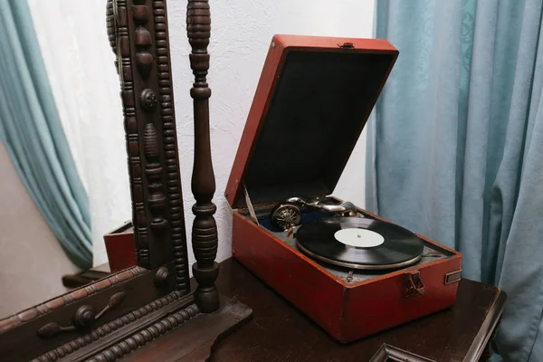 Vintage mirror and old gramophone