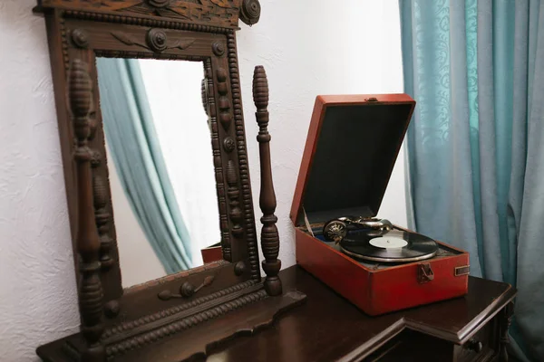 Vintage mirror and old gramophone