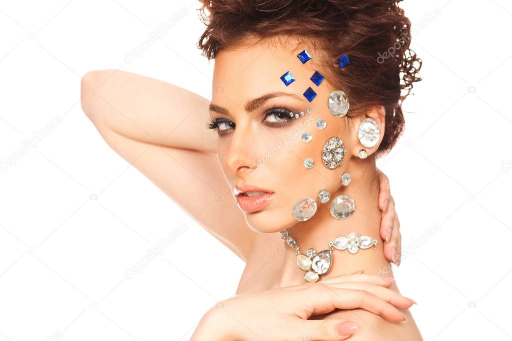portrait of beautiful girl with diamonds on her face
