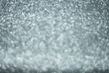 Odaklanamayan soyut gümüş ışıklar arka planı