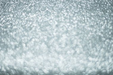 Odaklanamayan soyut gümüş ışıklar arka planı