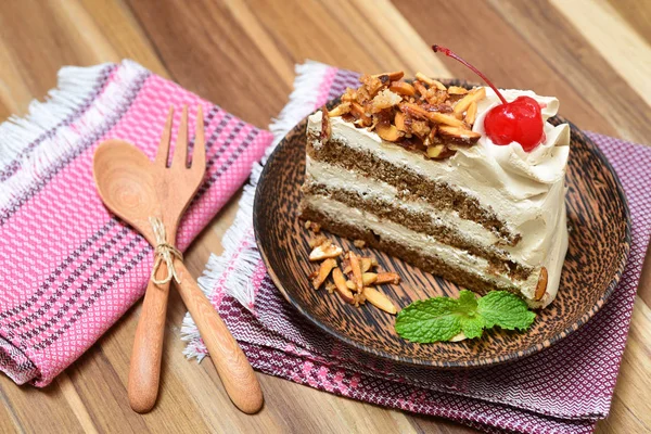Genoise coffee cake on wooden plate — Stock Photo, Image