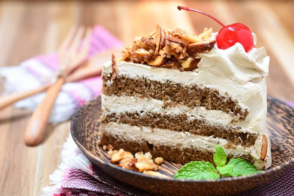 Genoise coffee cake on wooden plate — Stock Photo, Image