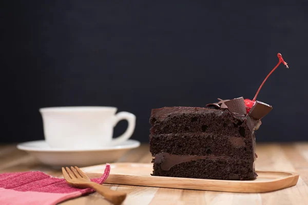 Chocolate cake with a coffee cup — Stock Photo, Image