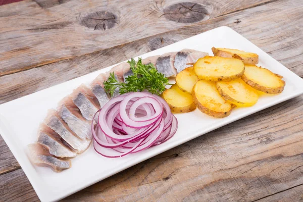 Sliced herring with potatoes — Stock Photo, Image