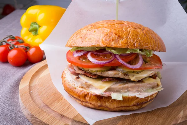 Hamburger on a wooden board — Stock Photo, Image