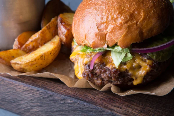 Hamburger with potatoes Stock Image