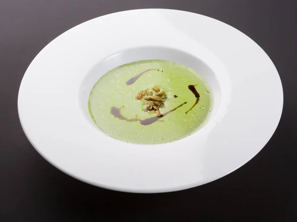 Green creamy vegetable soup in a white plate — Stock Image Green Creamy Vegetable Soup White Plate Royalty Free Stock Photos
